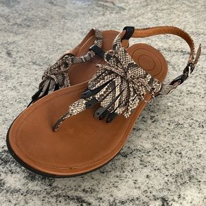 FitFlop flip flops with back straps and tassels. Leather snakeskin print.